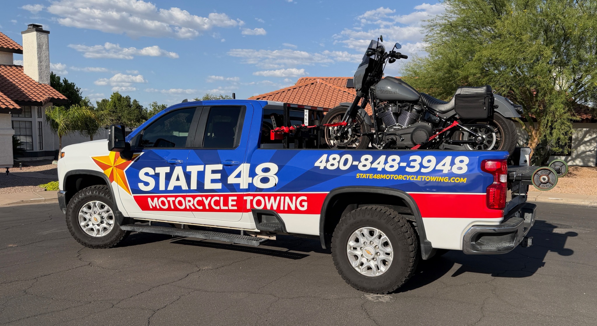 Motorcycle towing truck in Phoenix Arizona carrying a motorcycle